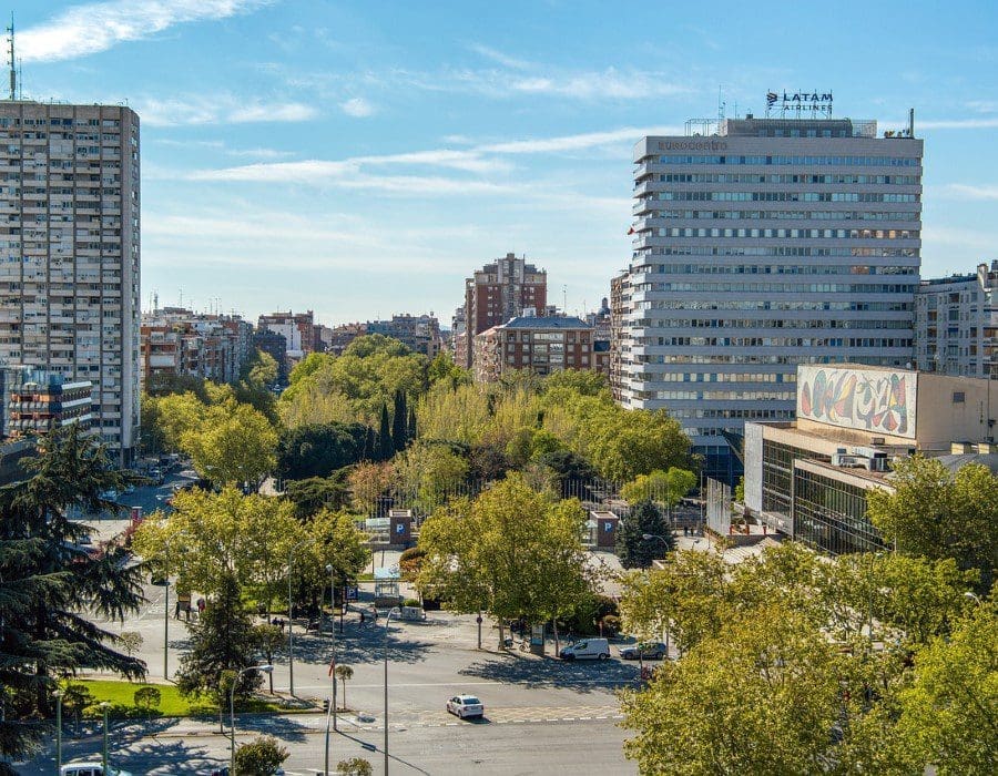 A view of some buildings and trees in the city.