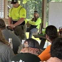 A group of people attending a training.