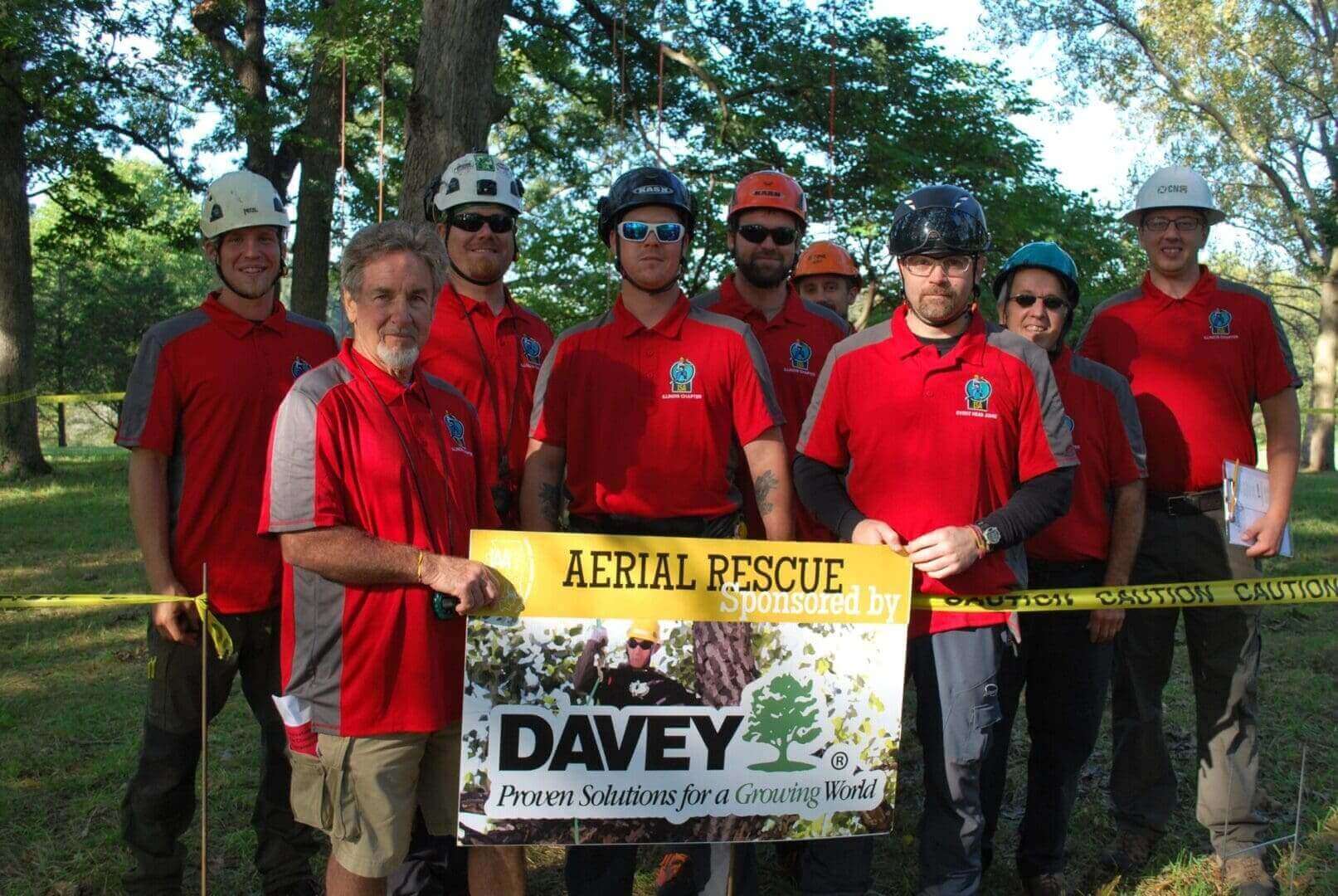 Tree climbers pose for aerial rescue photo.