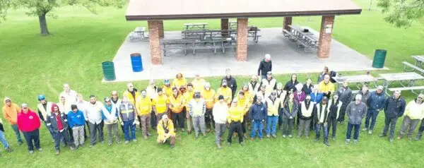 Group of people gathered in a park.